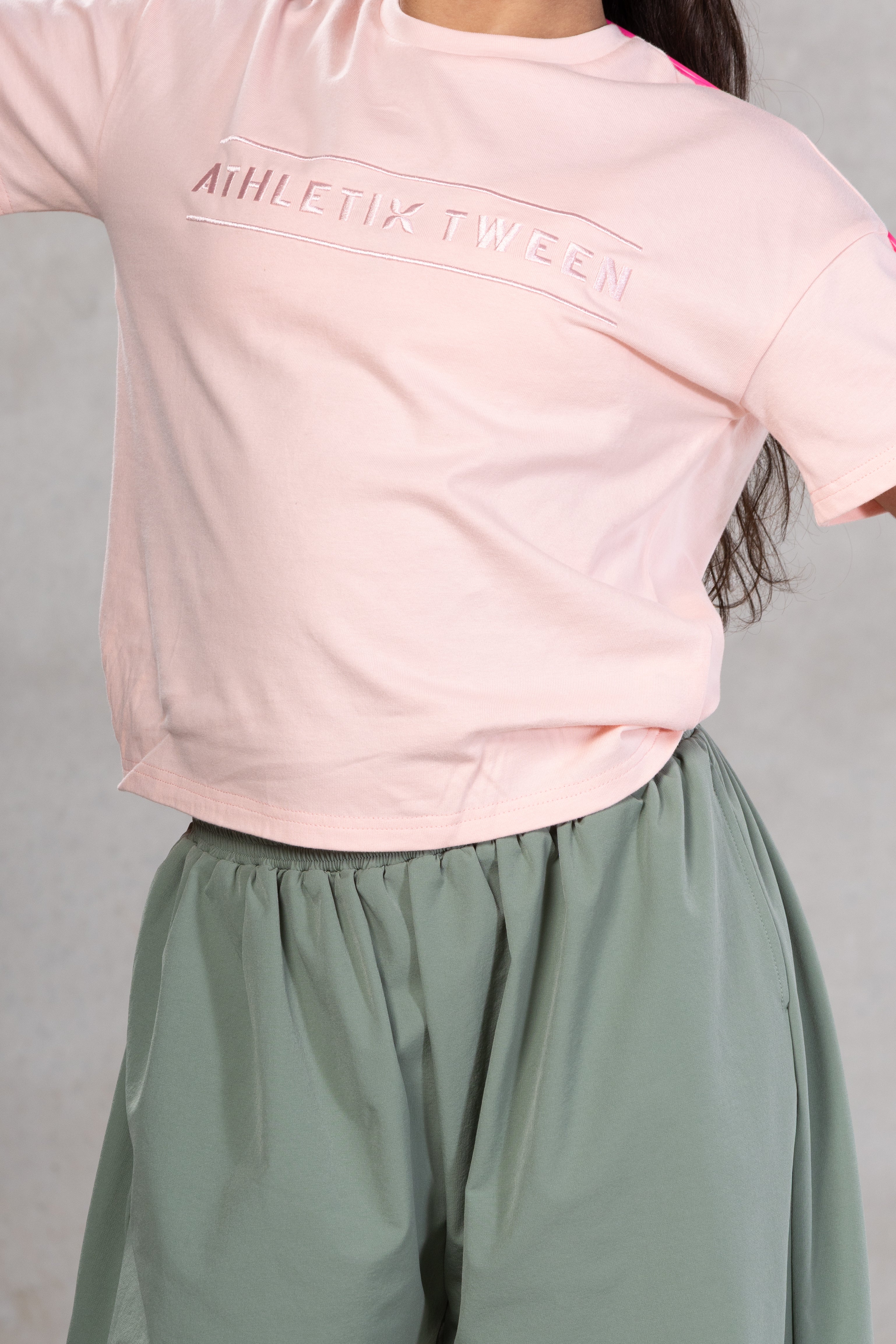 pink tshirt grey lower