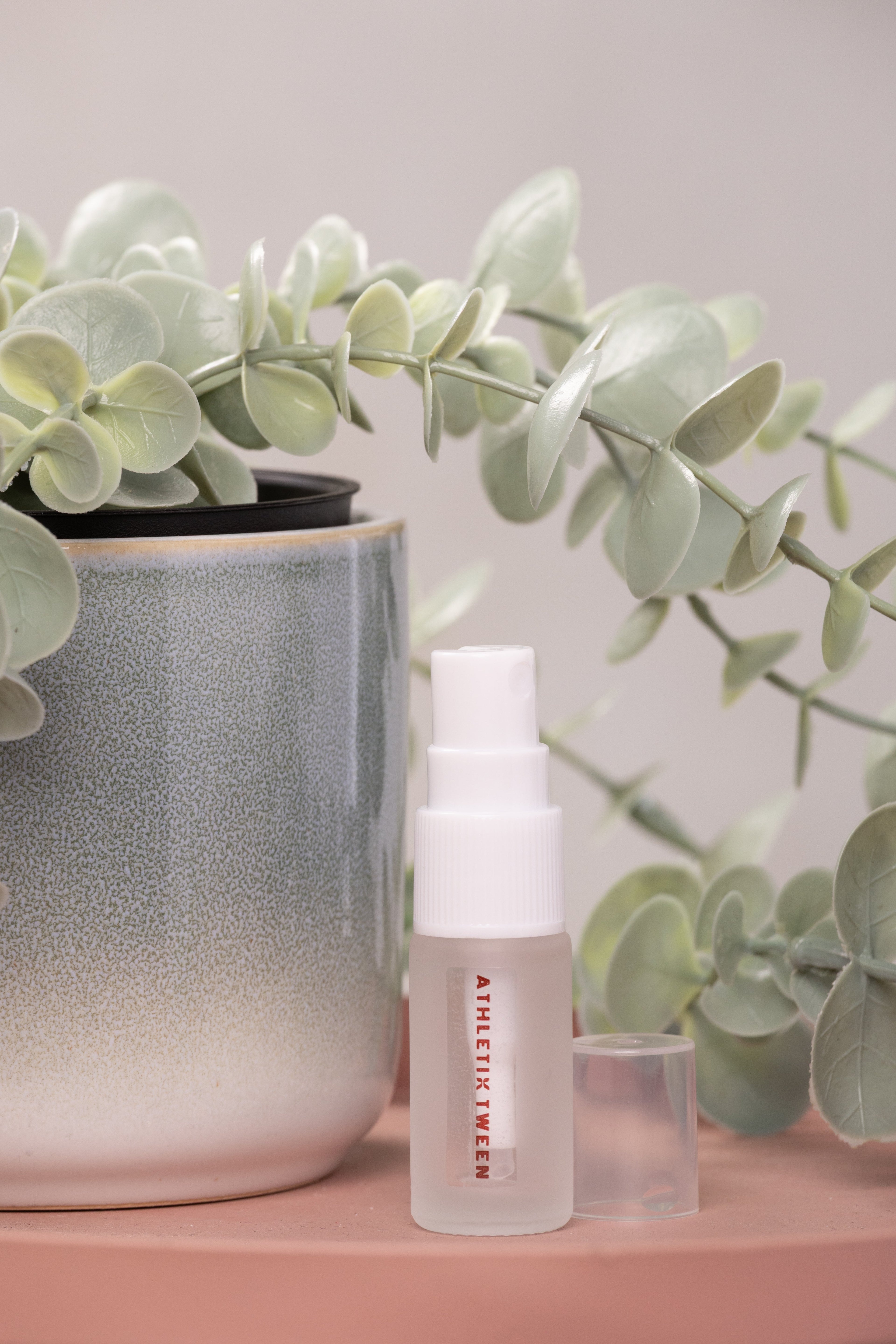 Skincare bottle with a plant in the background